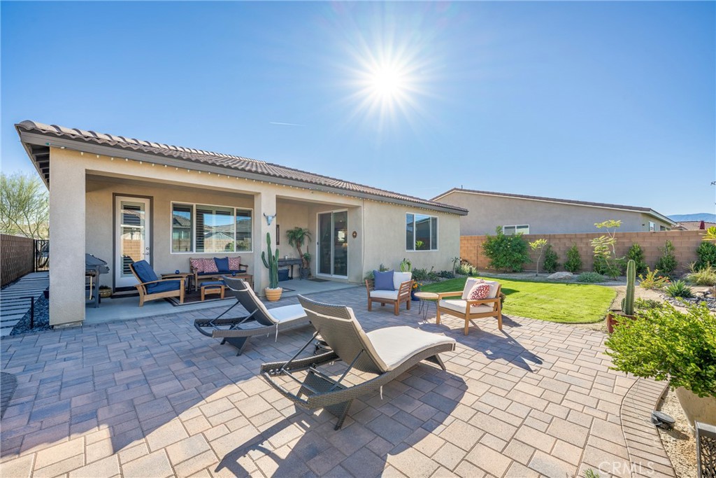 79244 Zamora Court Indio, CA 92203 - Photo 46 of 52 a view of a house with backyard sitting area and garden