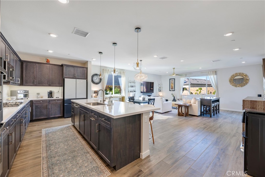 79244 Zamora Court Indio, CA 92203 - Photo 5 of 52 a kitchen with lots of counter top space and painting on the wall