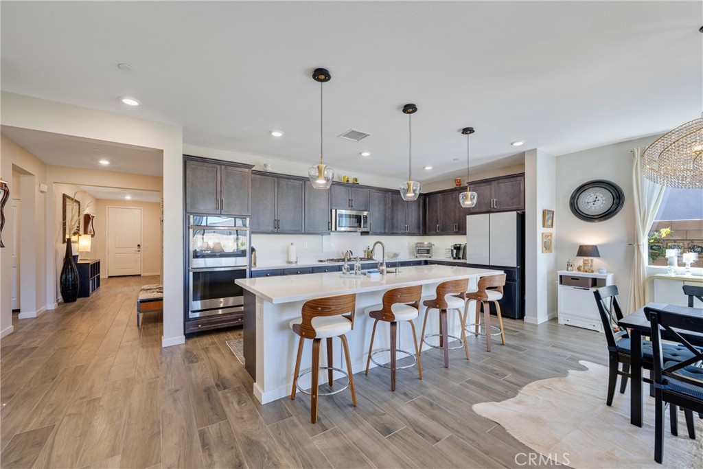 79244 Zamora Court Indio, CA 92203 - Photo 7 of 52 a large kitchen with a table and chairs