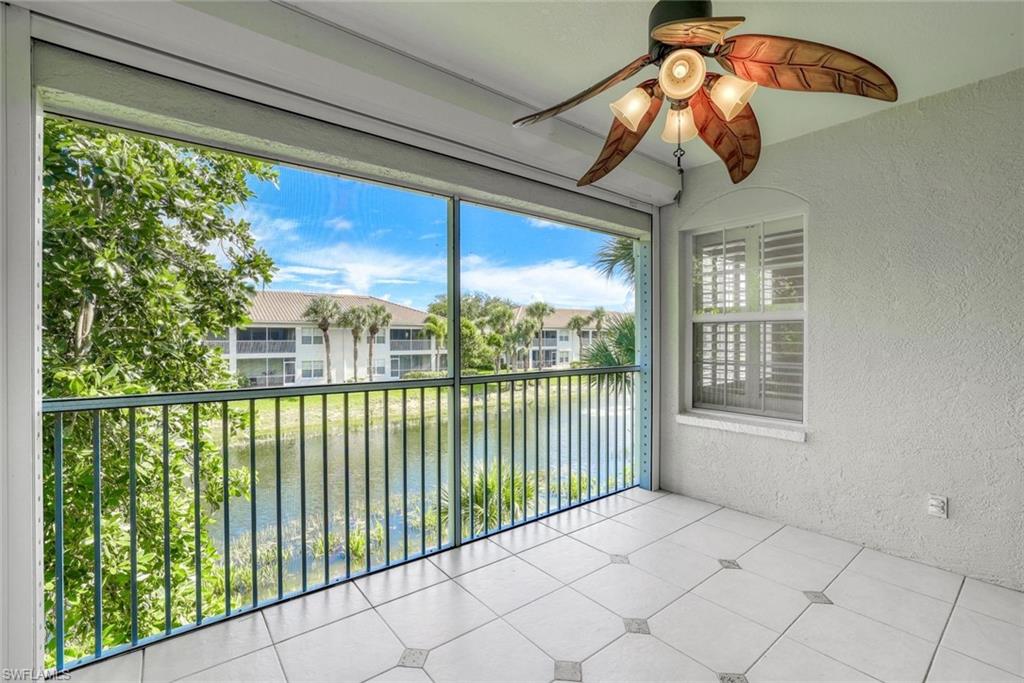 6914 Satinleaf Road North, Unit 202 Naples, FL 34109 - Photo 22 of 37 Unfurnished sunroom with ceiling fan