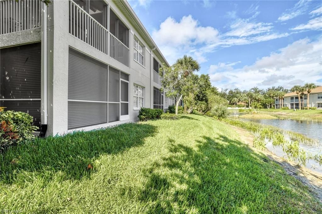 6914 Satinleaf Road North, Unit 202 Naples, FL 34109 - Photo 23 of 37 View of yard featuring a water view