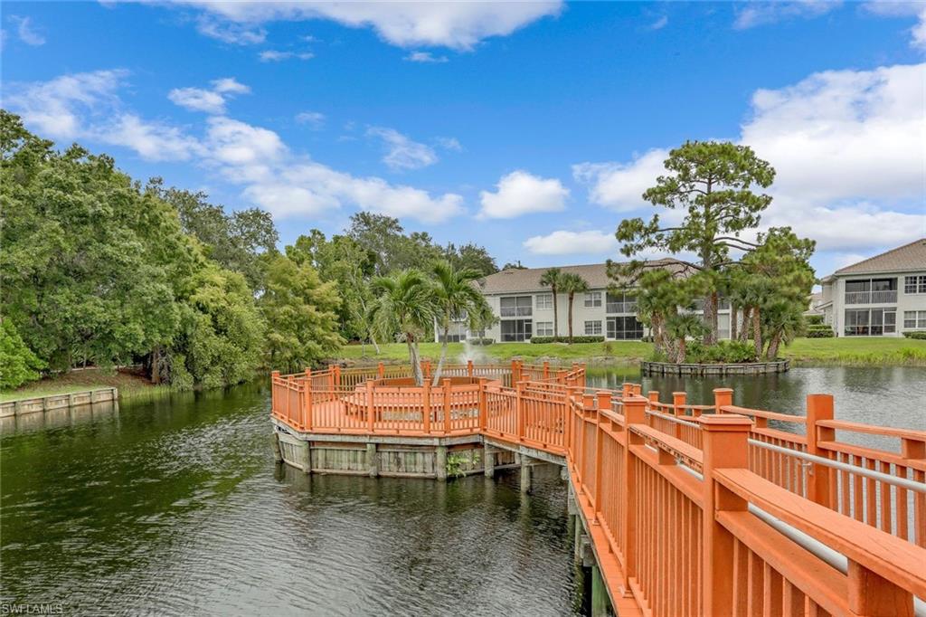 6914 Satinleaf Road North, Unit 202 Naples, FL 34109 - Photo 36 of 37 Dock area with a water view