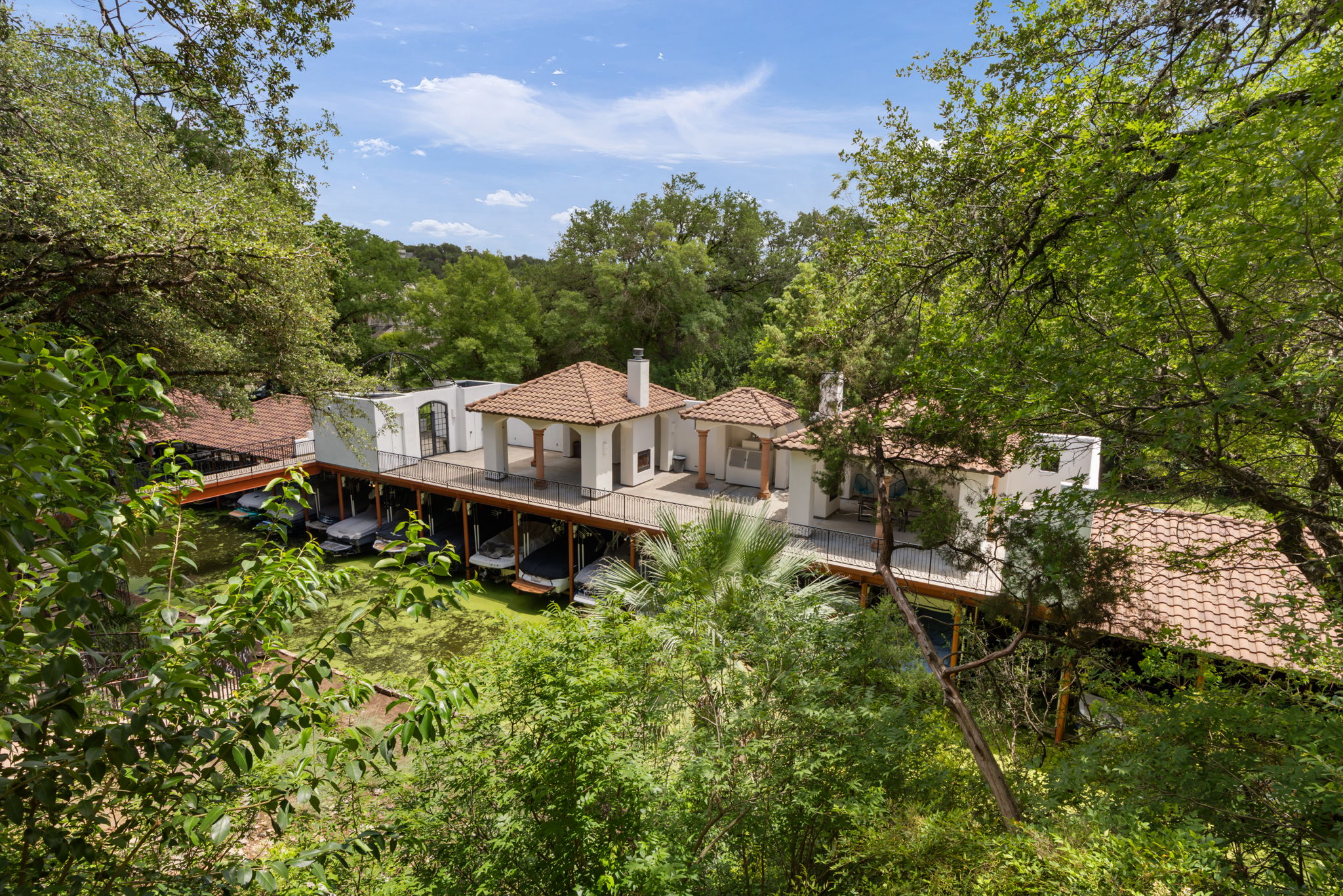 1910 Rue De St Tropez, Unit 6 Austin, TX 78746 - Photo 30 of 37 Boathouse with an upper deck offering serene waterfront living.