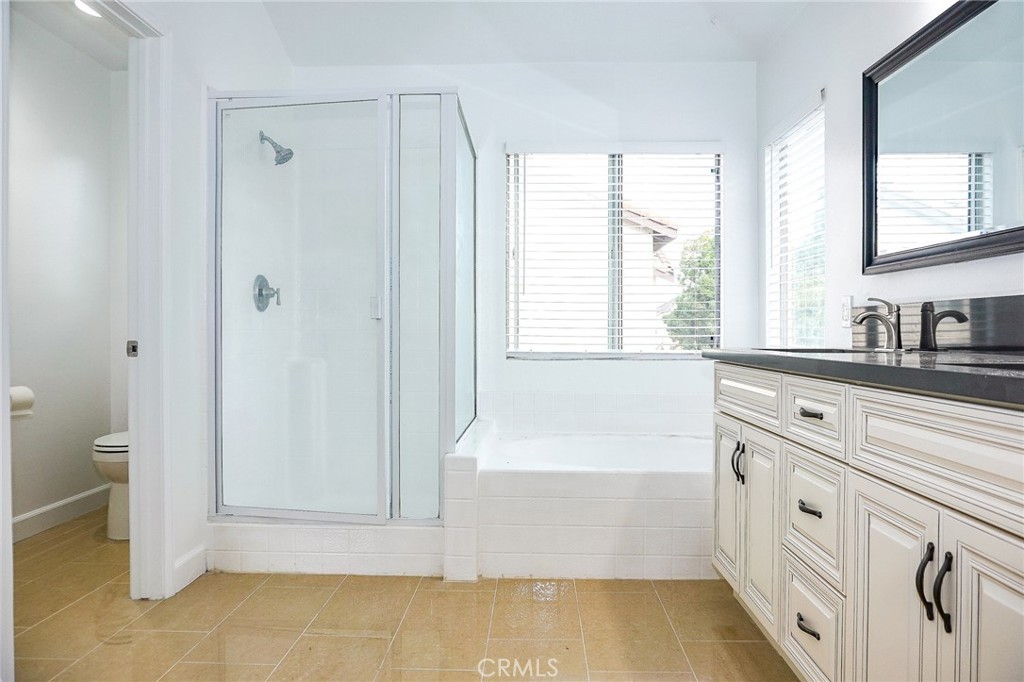 13142 Windsor Lane Garden Grove, CA 92843 - Photo 23 of 24 a bathroom with a bathtub and a sink