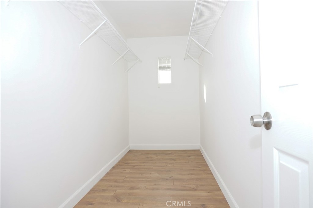 13142 Windsor Lane Garden Grove, CA 92843 - Photo 24 of 24 a view of a hallway with wooden floor