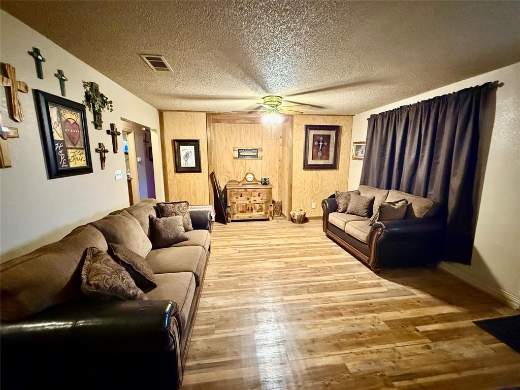 555 South Allen Street Boyd, TX 76023 - Photo 4 of 14 a living room with furniture and a couch