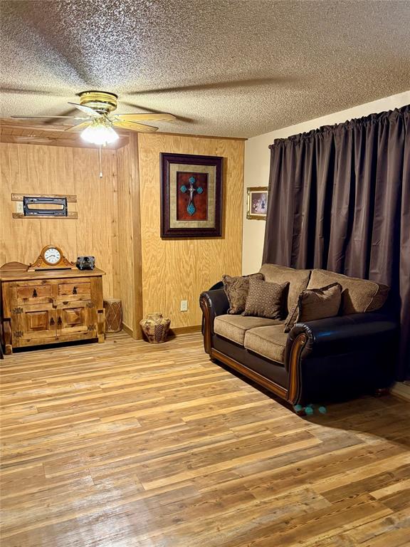 555 South Allen Street Boyd, TX 76023 - Photo 5 of 14 a living room with furniture and a mirror