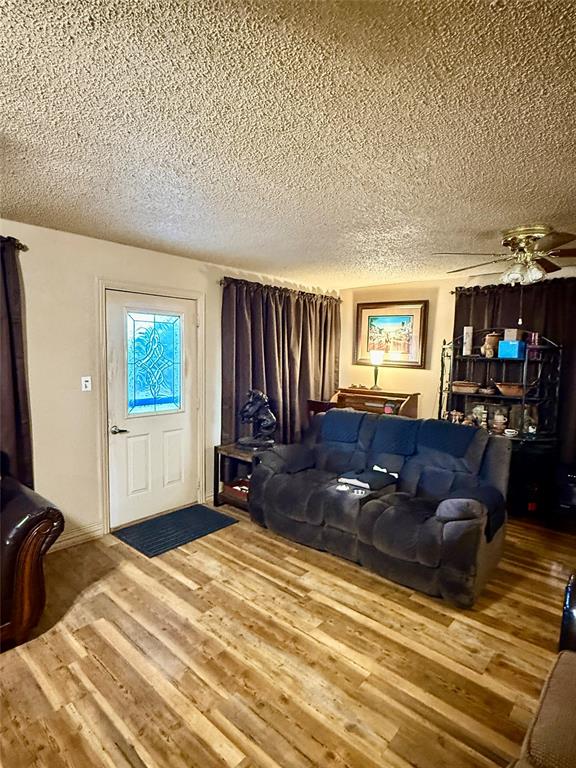 555 South Allen Street Boyd, TX 76023 - Photo 6 of 14 a bedroom with a bed window and couch