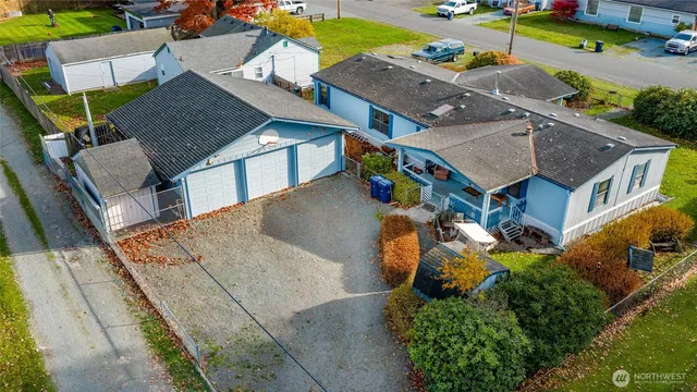 an aerial view of a house with a yard