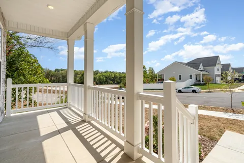 a view of a balcony with wooden floor