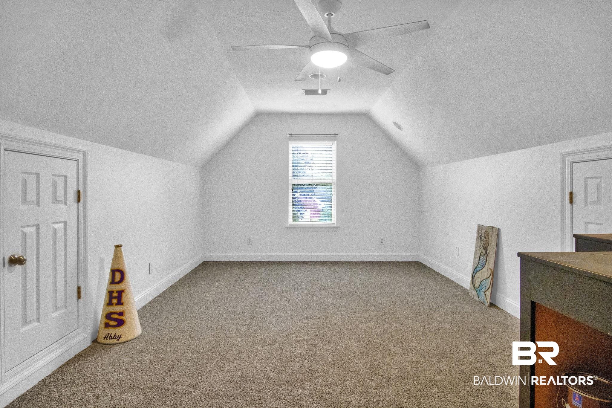 9002 Parliament Circle Daphne, AL 36526 - Photo 54 of 73 room featuring ceiling fan, new carpet floors, and TWO attic storage closets , and vaulted ceiling