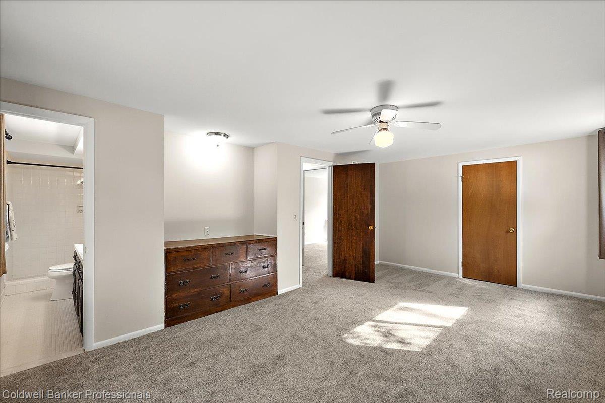 78 Carter Avenue Troy, MI 48098 - Photo 21 of 52 Unfurnished bedroom featuring carpet flooring, ceiling fan, and ensuite bath