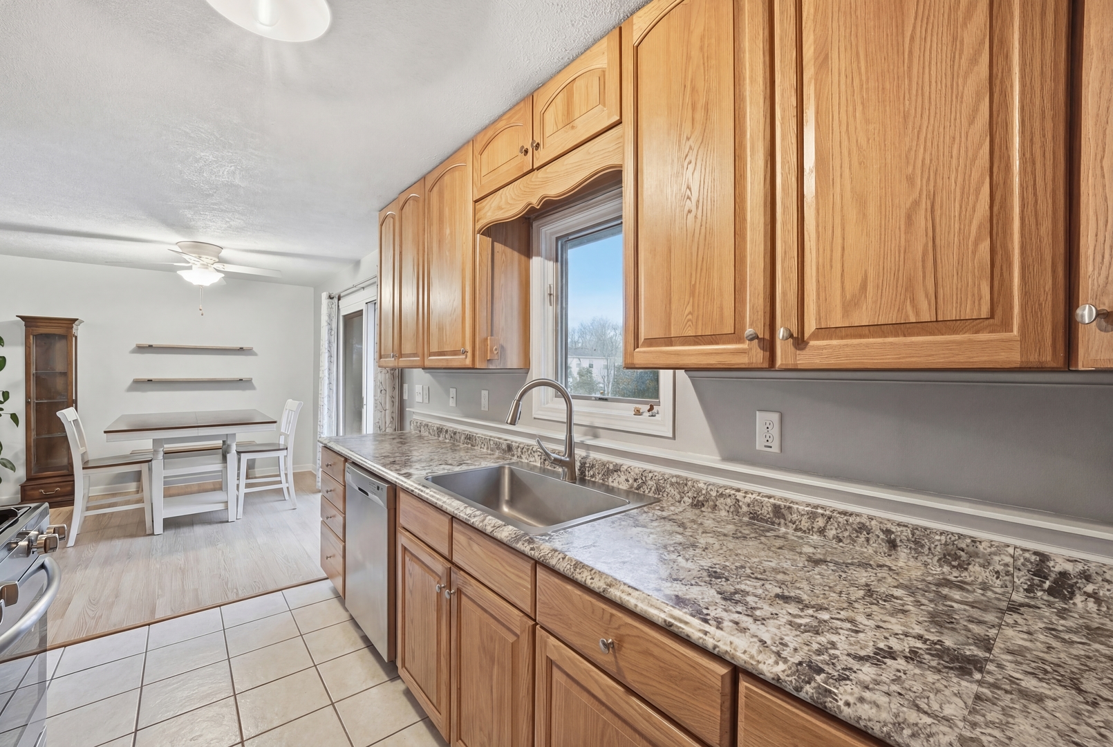 200 Ramona Avenue Rochelle, IL 61068 - Photo 12 of 21 a kitchen with stainless steel appliances a sink and cabinets