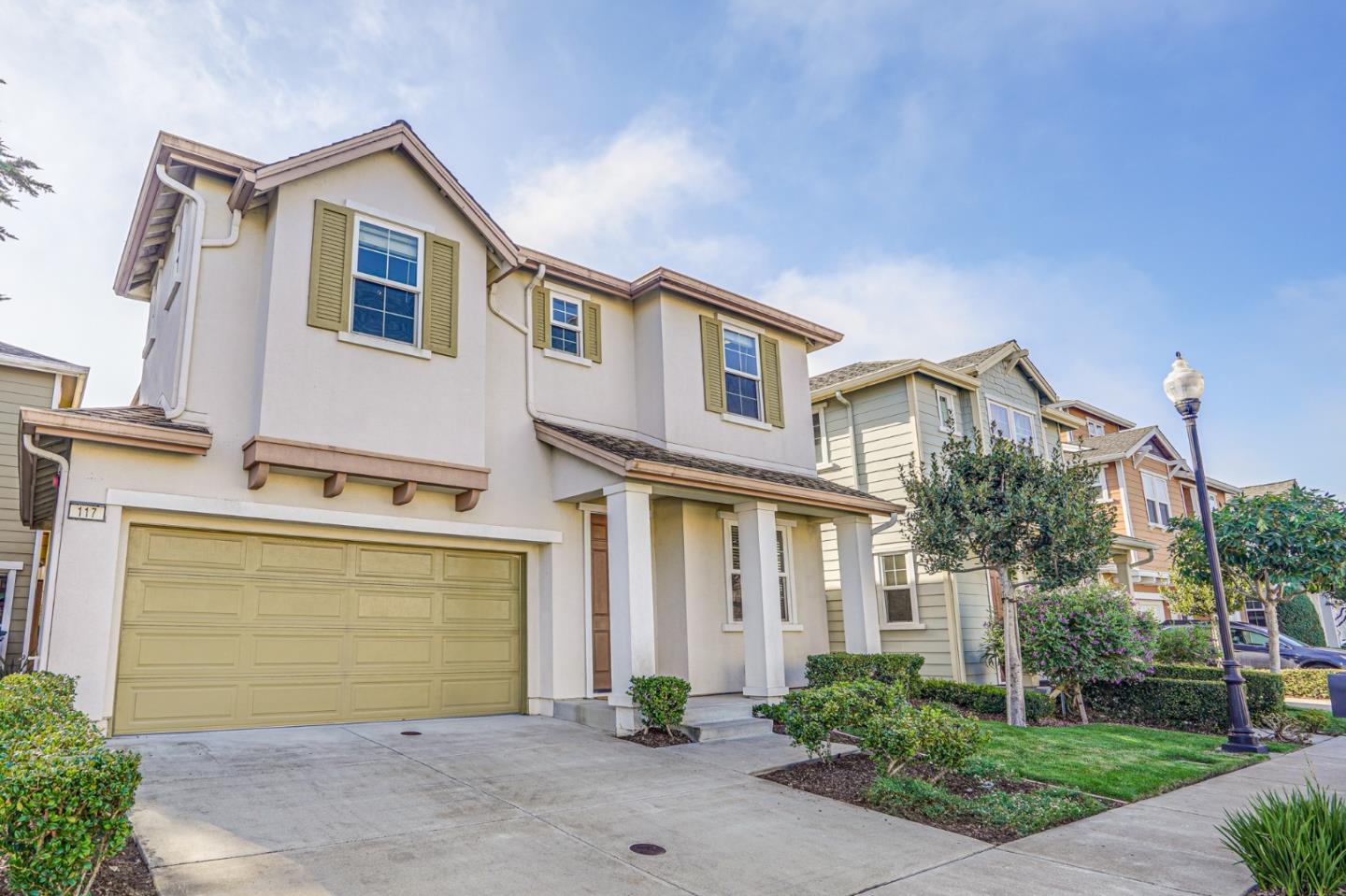 117 Cypress Street Pacifica, CA 94044 - Photo 1 of 40 a front view of a house with a yard and garage
