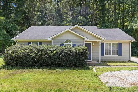 a house that has a lot of plants in it