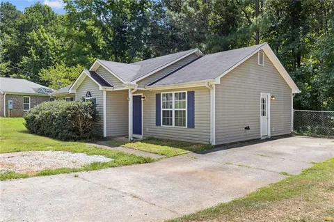 front view of a house and a yard