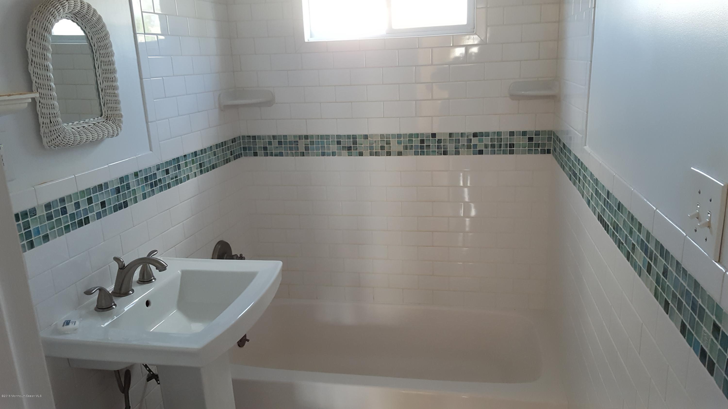 716 Shore Road Spring Lake Heights, NJ 07762 - Photo 4 of 7 a bathroom with a sink and a mirror