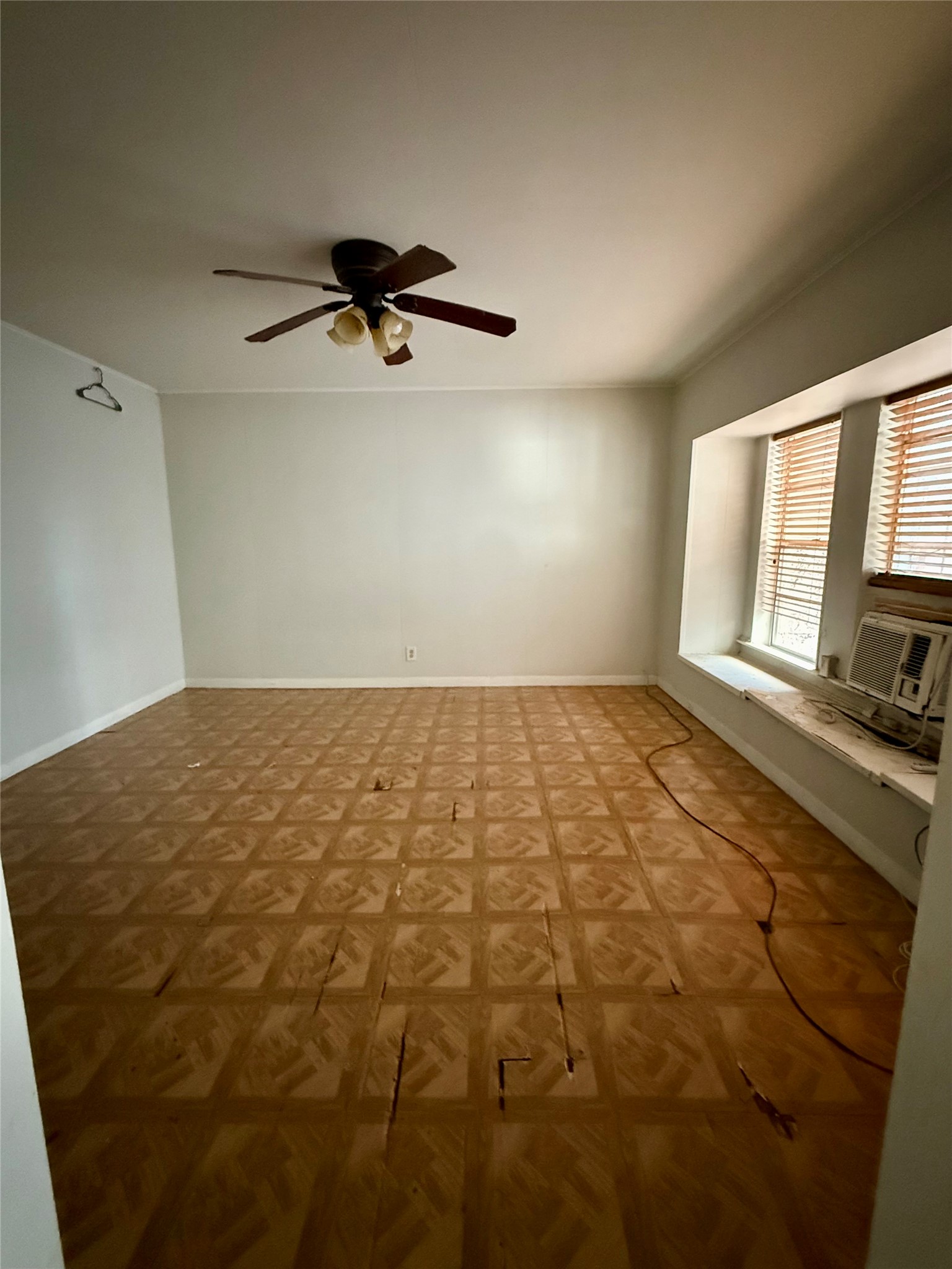 1526 Yale Street, Unit 2 Houston, TX 77008 - Photo 5 of 8 a view of a room with a empty space and a window