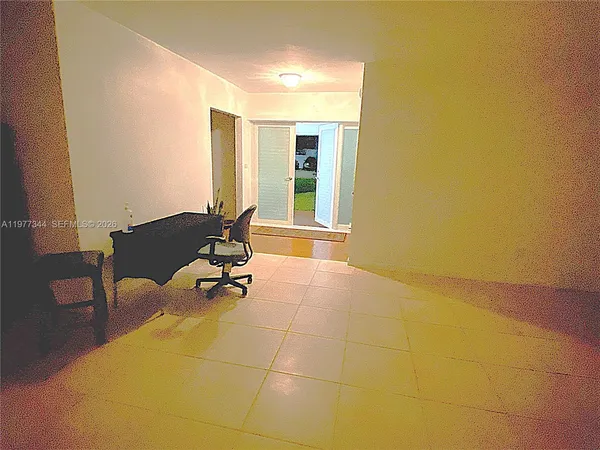 a view of a livingroom with furniture and staircase