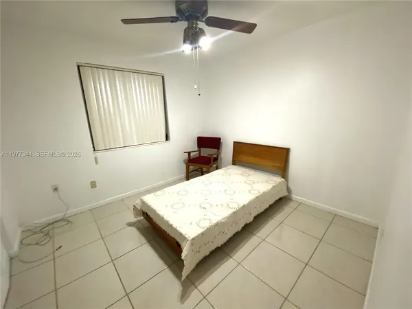 a room with a dresser and a mirror