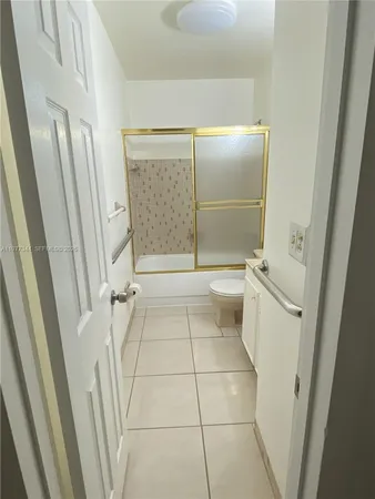 a bathroom with a sink toilet and mirror