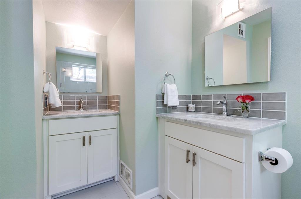 3605 Merrell Road Dallas, TX 75229 - Photo 10 of 25 a bathroom with a granite countertop sink mirror and vanity