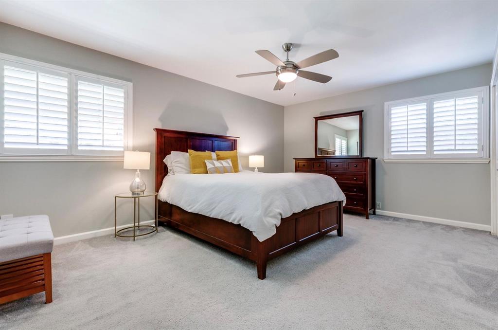 3605 Merrell Road Dallas, TX 75229 - Photo 11 of 25 a bedroom with a bed chandelier and a window