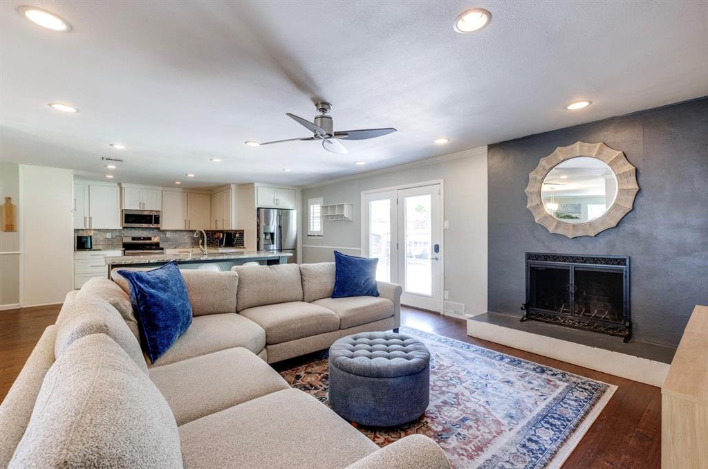 3605 Merrell Road Dallas, TX 75229 - Photo 21 of 25 a living room with furniture and a fireplace