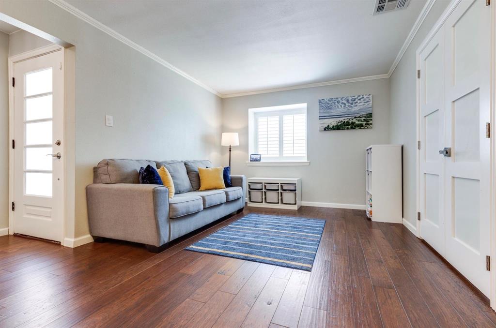 3605 Merrell Road Dallas, TX 75229 - Photo 23 of 25 a living room with furniture and a wooden floor