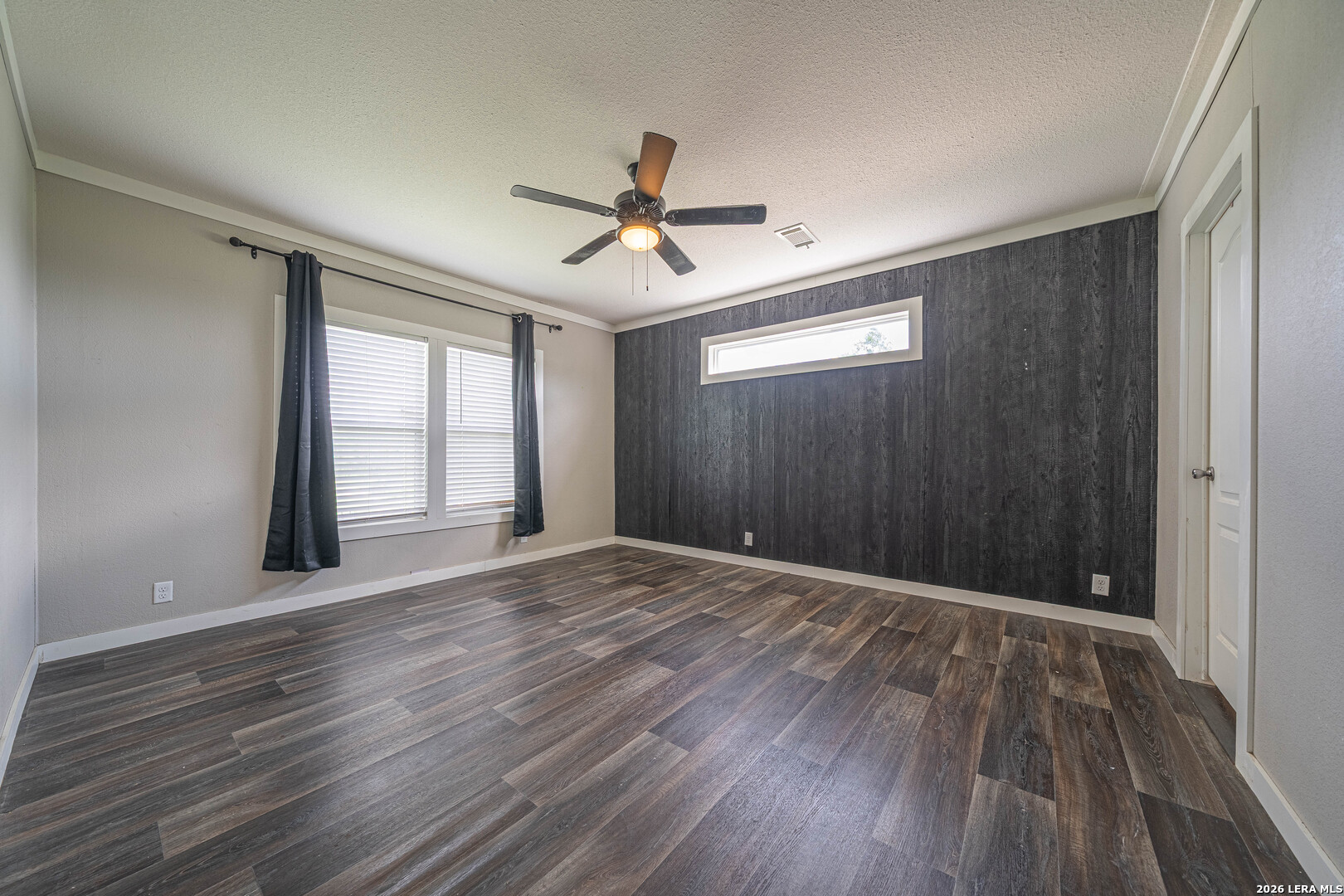 3433 Gander Slough Road Kingsbury, TX 78638 - Photo 12 of 23 wooden floor in an empty room with a window