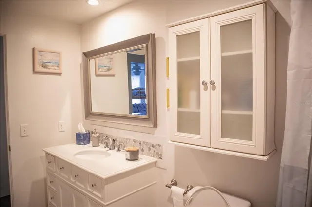 a bathroom with a sink and a mirror