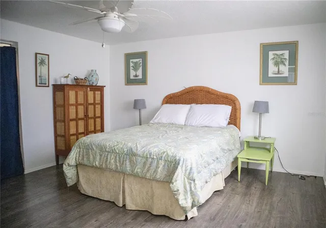 a bedroom with a bed and a table