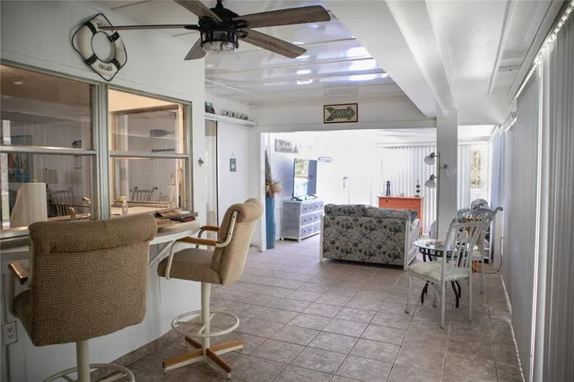 a bedroom with furniture and a window