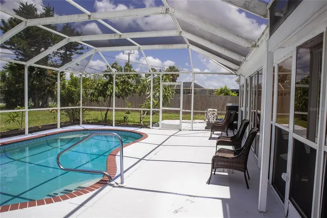 a view of a room with gym equipment and a large window