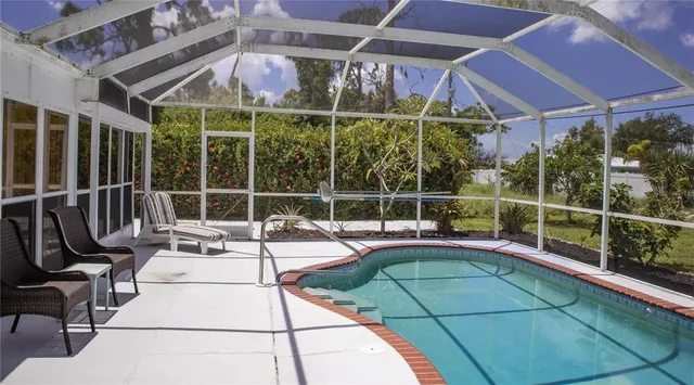 a view of a swimming pool with a porch