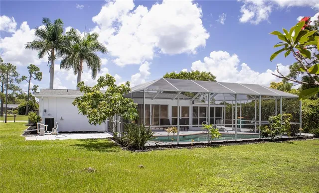a front view of a house with swimming pool and glass windows