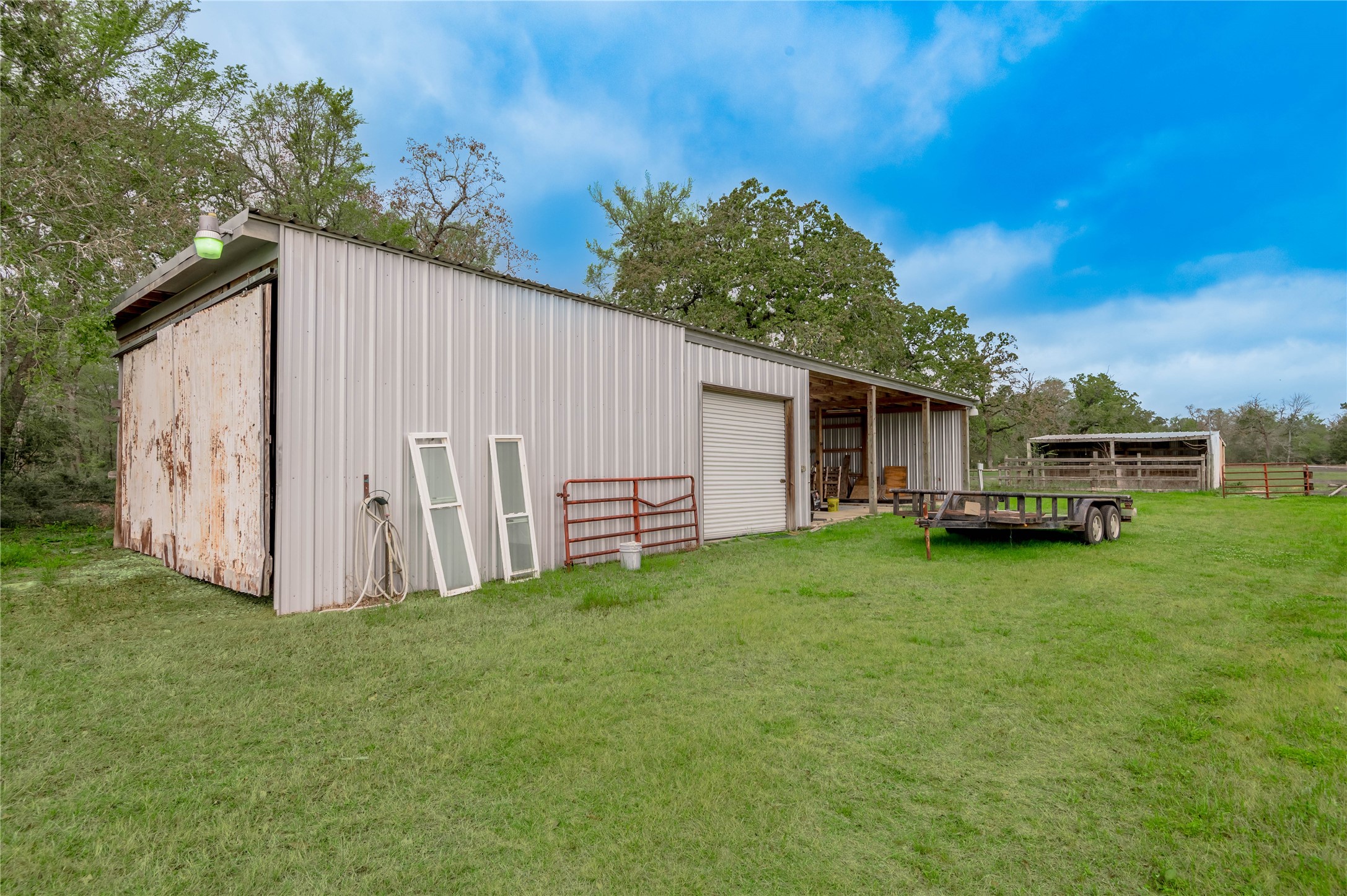 758 Wire Road Huntsville, TX 77320 - Photo 30 of 44 a view of a house with backyard