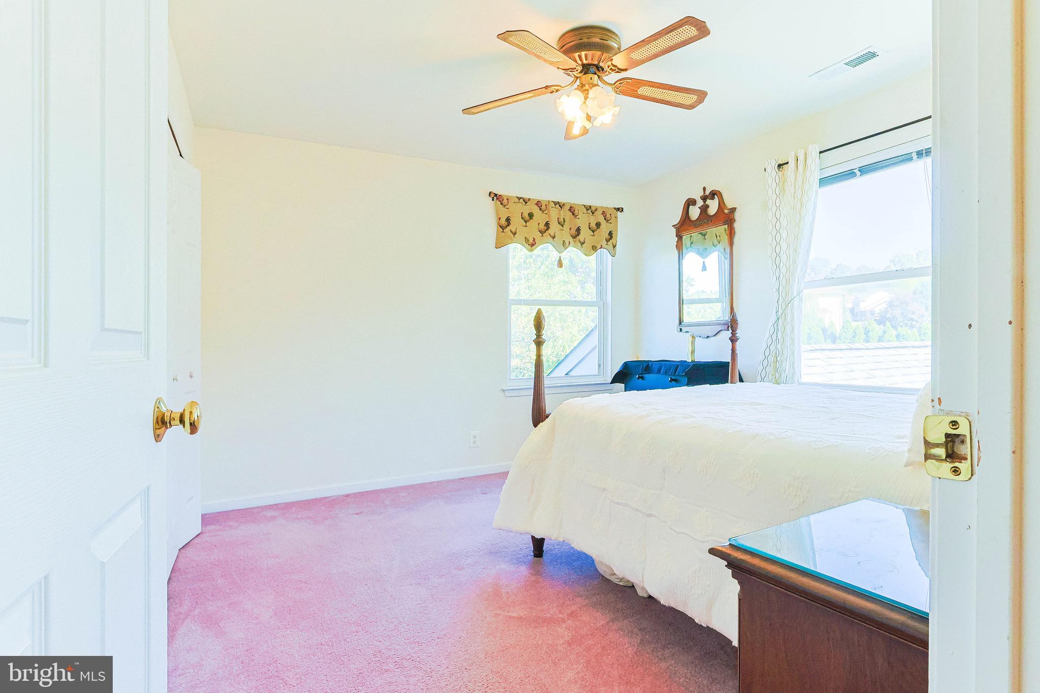 2270 Dale Road Huntingdon Valley, PA 19006 - Photo 23 of 36 a bedroom with a bed and a chandelier