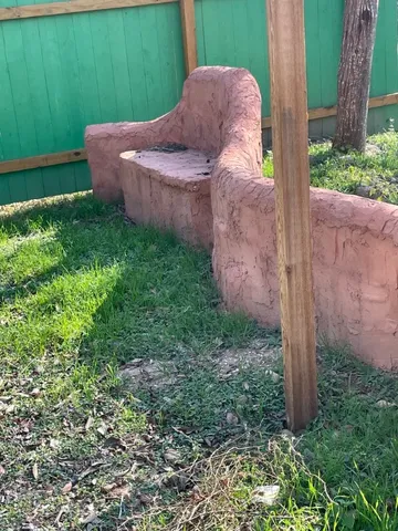 a backyard of a house with lots of green space and plants