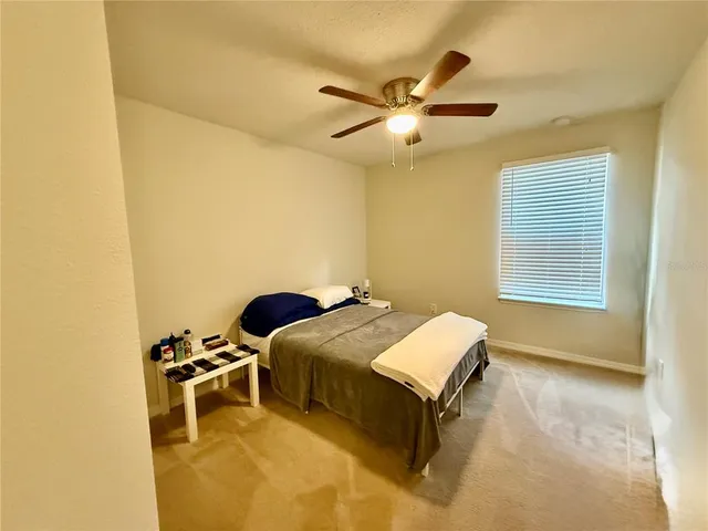 a bathroom with a sink vanity mirror and toilet