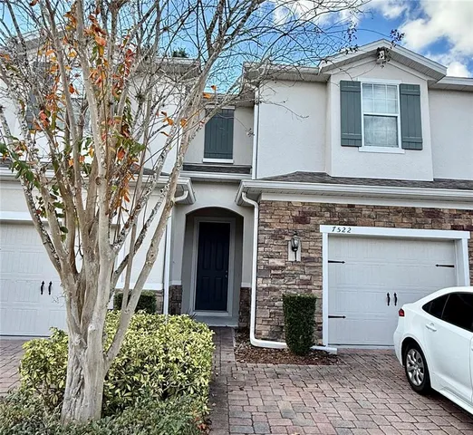 a kitchen with stainless steel appliances kitchen island granite countertop a sink and cabinets