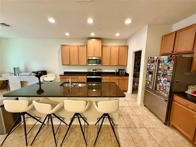 a bathroom with a sink and mirror with toilet