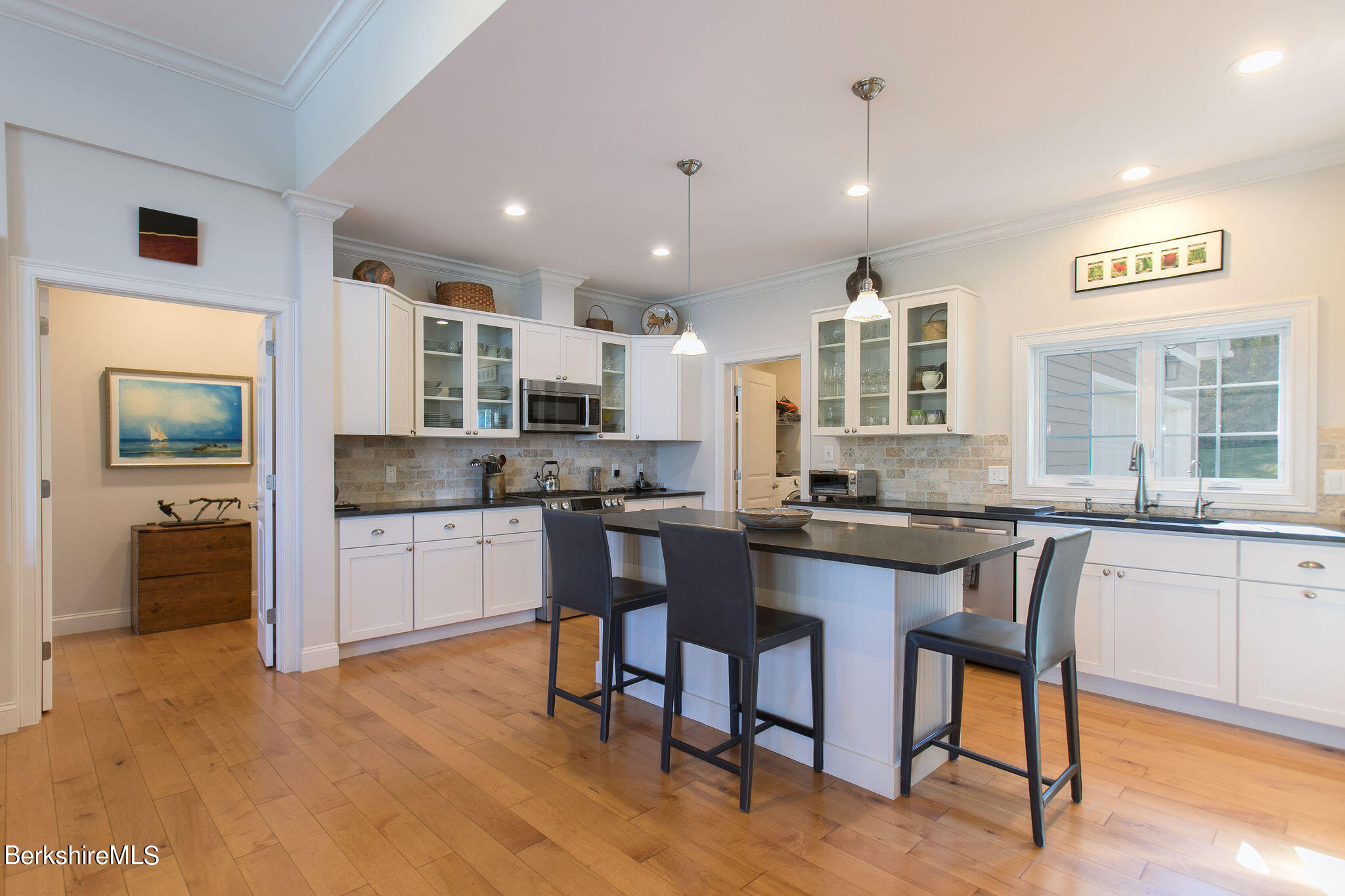 19 Burning Tree Road Great Barrington, MA 01230 - Photo 11 of 33 a kitchen with a sink cabinets and dining table chair