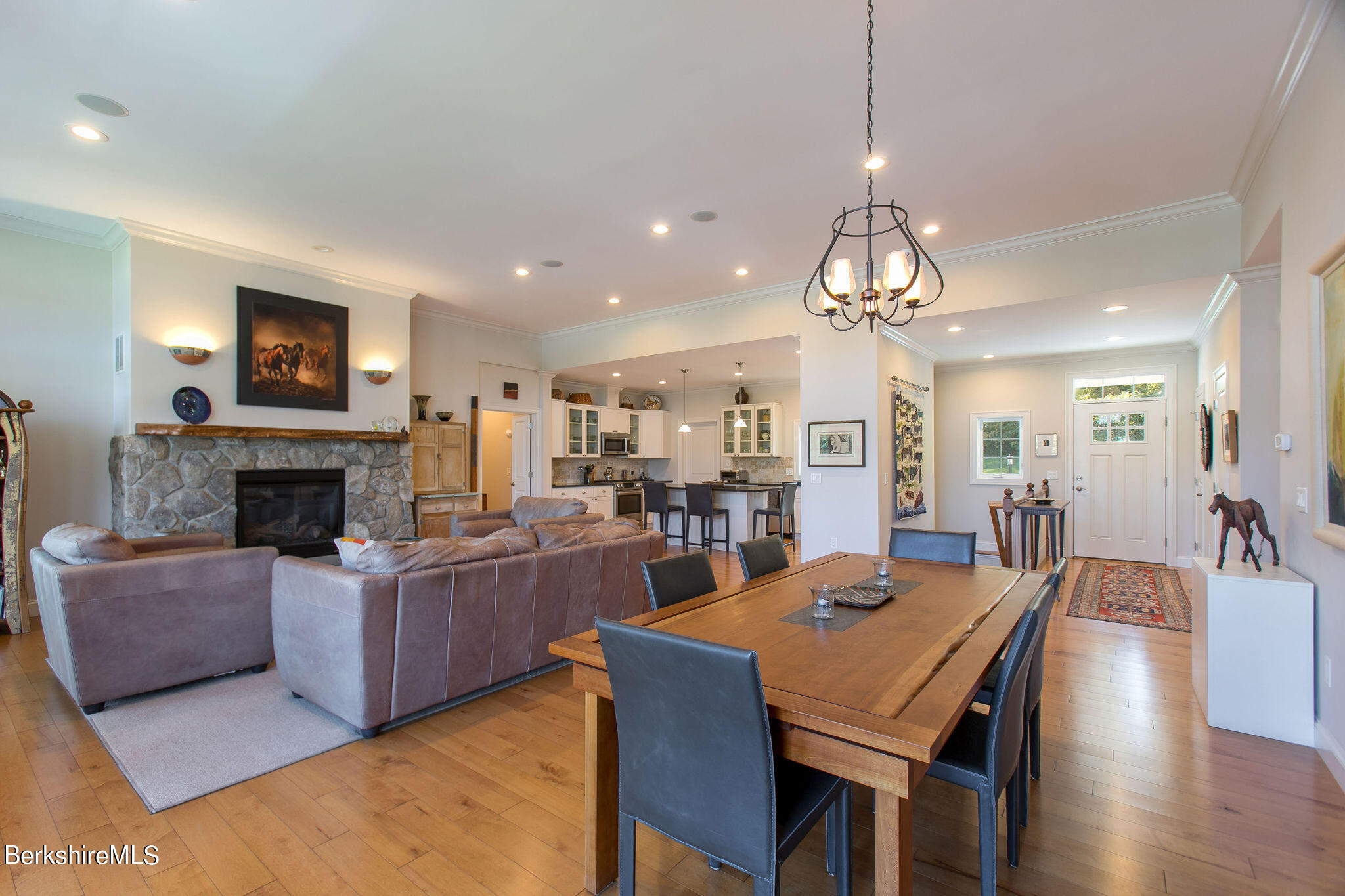 19 Burning Tree Road Great Barrington, MA 01230 - Photo 12 of 33 a living room with furniture a fireplace and kitchen view