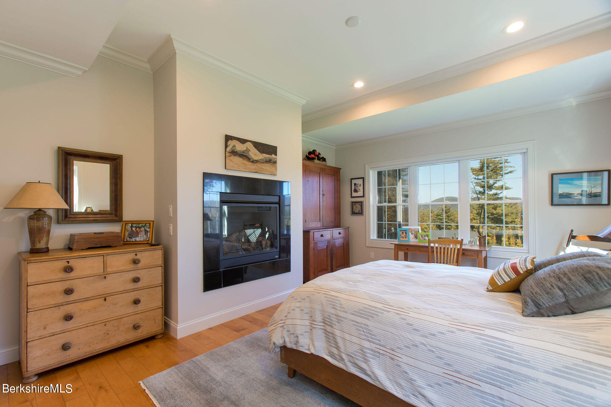 19 Burning Tree Road Great Barrington, MA 01230 - Photo 13 of 33 a bedroom with a large bed and a tv