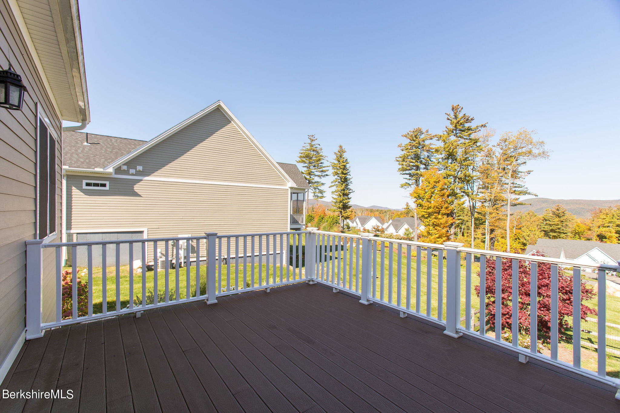 19 Burning Tree Road Great Barrington, MA 01230 - Photo 19 of 33 a view of a balcony with wooden floor and fence