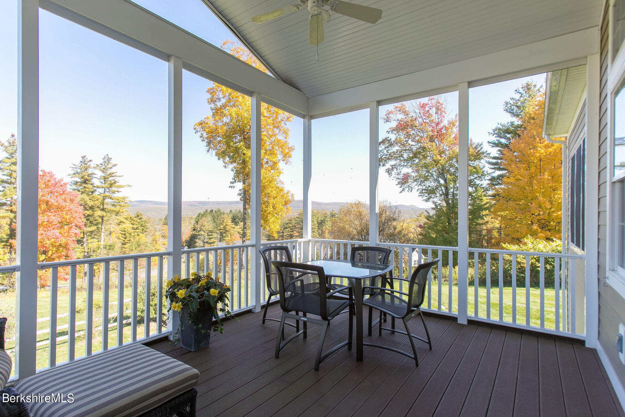 19 Burning Tree Road Great Barrington, MA 01230 - Photo 20 of 33 a view of a balcony with chairs and wooden floor
