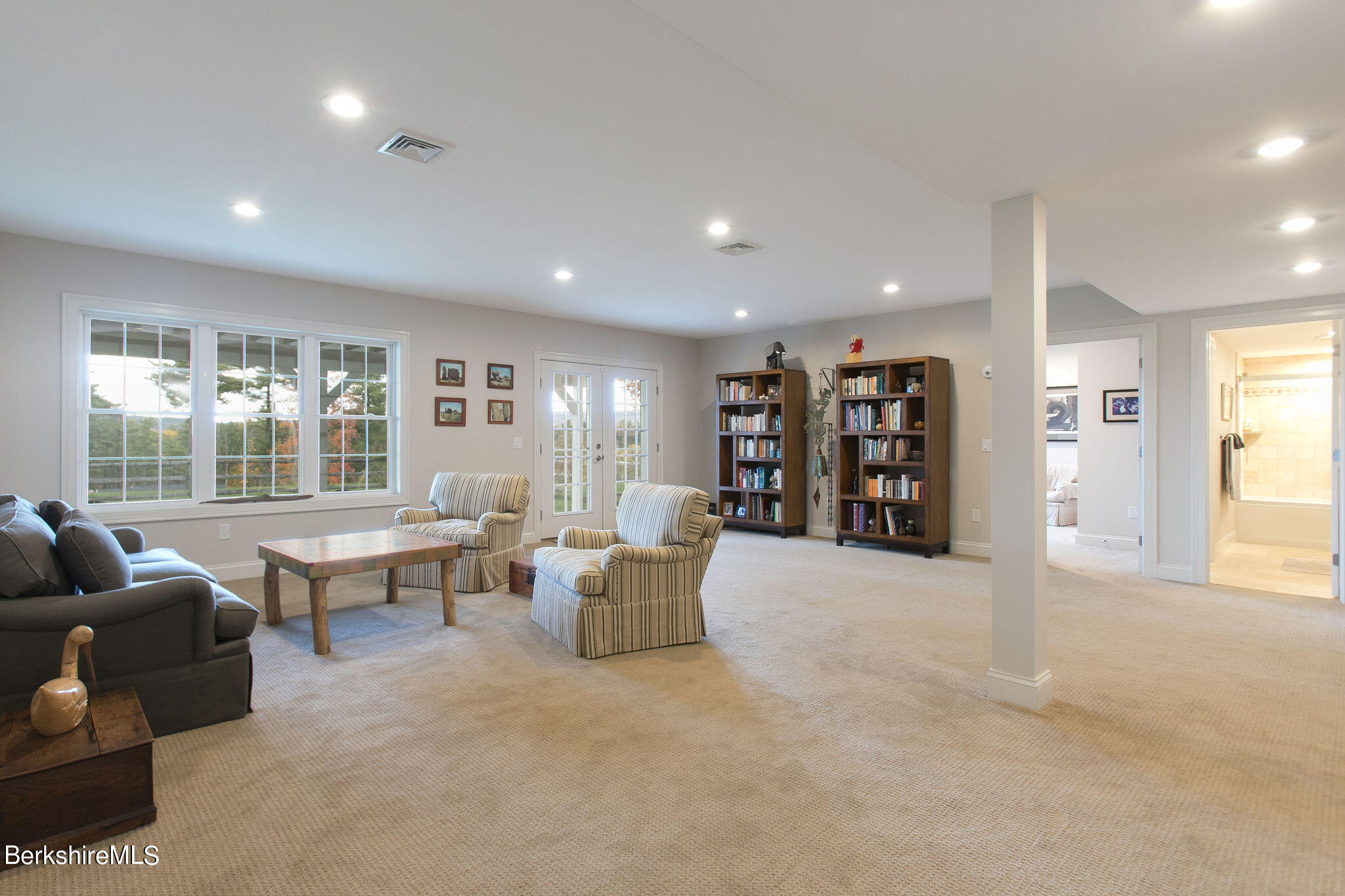 19 Burning Tree Road Great Barrington, MA 01230 - Photo 23 of 33 a living room with furniture and large window