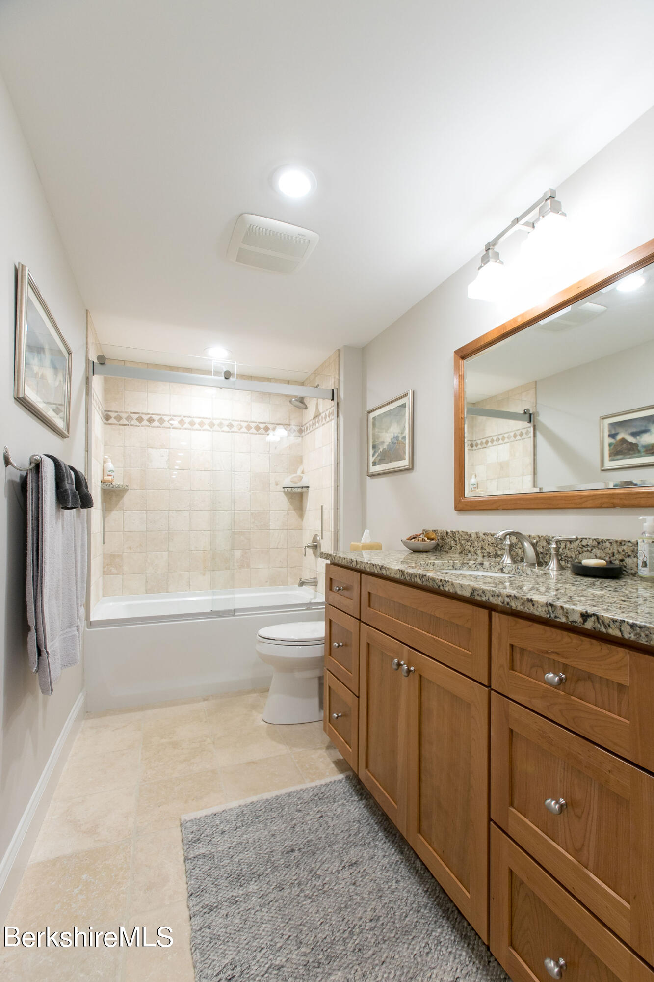 19 Burning Tree Road Great Barrington, MA 01230 - Photo 26 of 33 a bathroom with a granite countertop sink and a mirror