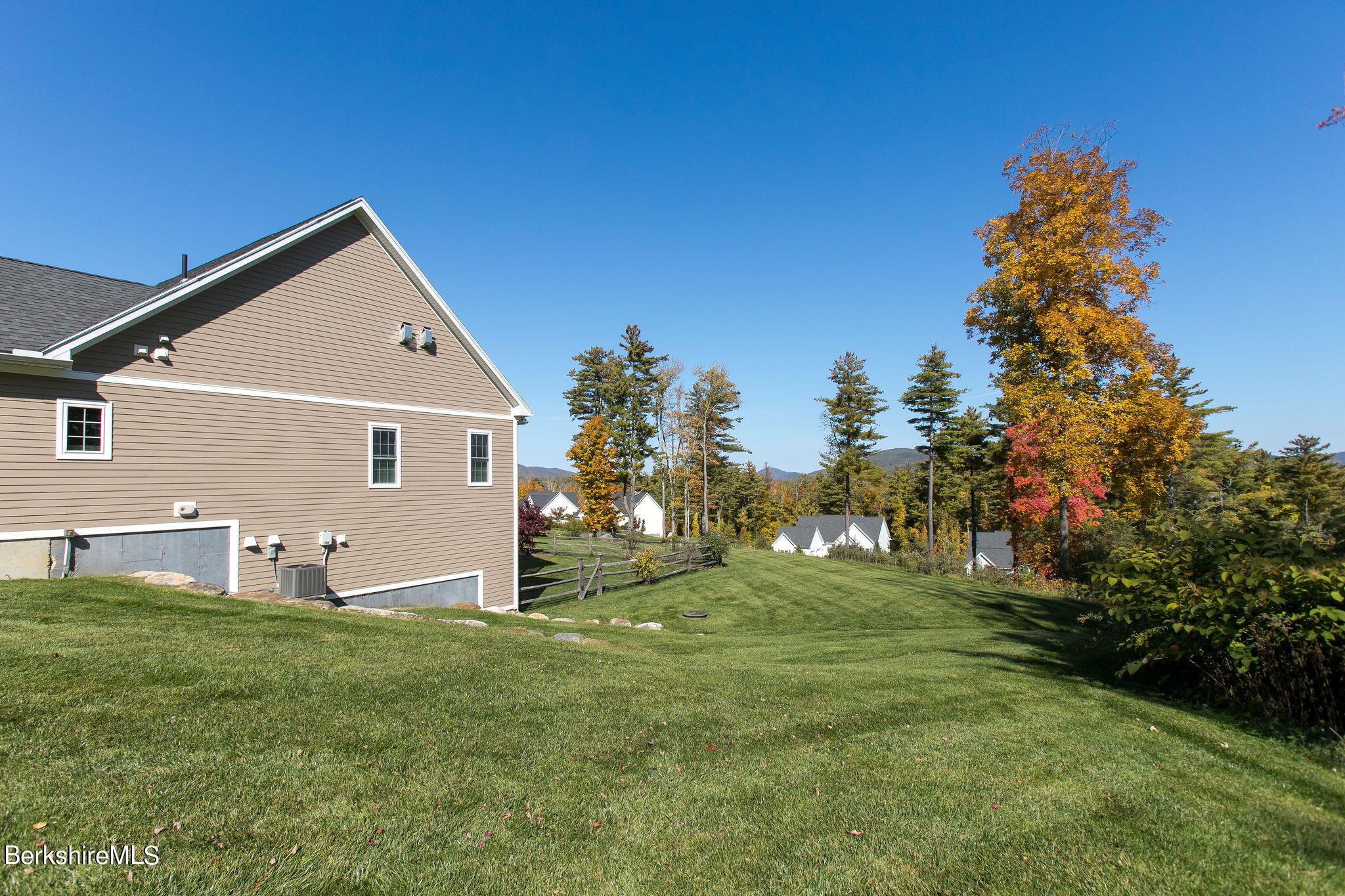 19 Burning Tree Road Great Barrington, MA 01230 - Photo 31 of 33 a front view of house with yard and trees in the background
